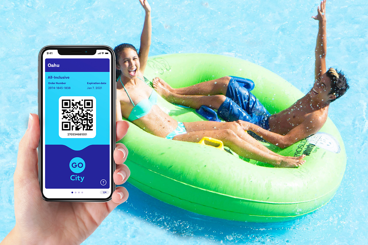 HVCB_2_1 Person holding phone showing mobile app while 2 people swim in the background