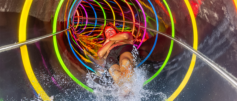 Volcanic-Wedgeee-Rings Boy swimming underwater in wave pool